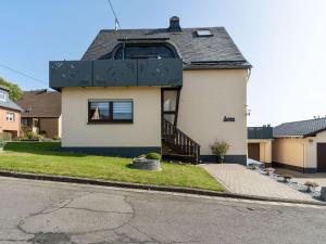 a house with a black roof at Apartment in Westerwald with private balcony 