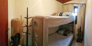 a bedroom with a bunk bed in a room at Casa no Arraial do Sana in Sana +32 photos