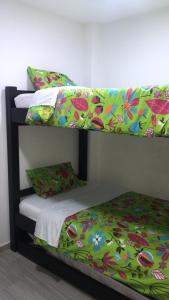 Postel nebo postele na pokoji v ubytování Hotel Palmi
