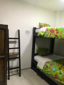 Postel nebo postele na pokoji v ubytování Hotel Palmi