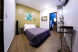 Voodi või voodid majutusasutuse Coaranda Hotel Boutique toas