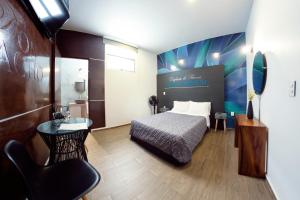 Voodi või voodid majutusasutuse Coaranda Hotel Boutique toas