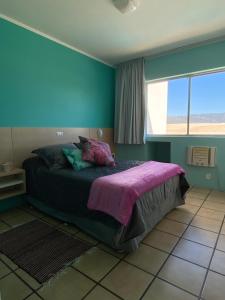 מיטה או מיטות בחדר ב-Via Praia Apart Hotel