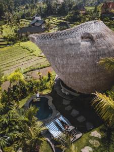 an aerial view of a resort with a swimming pool at Veluvana Bali in Sidemen