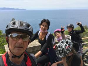 a group of people on a bike near the ocean at Bike&Boat Argentario Hotel in Porto Santo Stefano