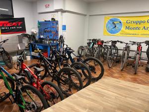 a bunch of bikes parked in a room at Bike&Boat Argentario Hotel in Porto Santo Stefano