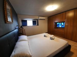 Posteľ alebo postele v izbe v ubytovaní La Piccolina