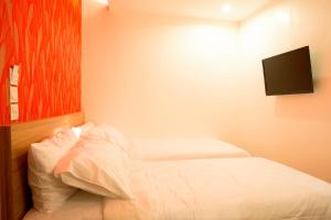 Cama o camas de una habitación en DeMira Hotel