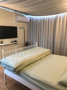 Letto o letti in una camera di Yun Ting Orchid Garden