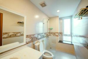 a bathroom with a toilet and a sink at Kien Vang Bungalow in Phu Quoc +31 photos