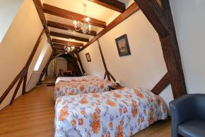 Postel nebo postele na pokoji v ubytování Hotel Restaurant Dontenville