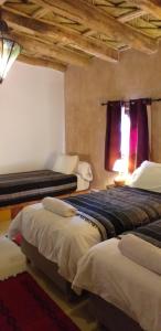 Postel nebo postele na pokoji v ubytování La Kasbah d'Ouzoud