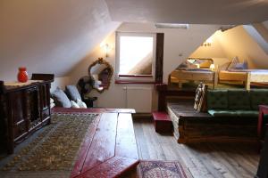 a living room with a couch and a bed at Baderhaus in Bruck an der Mur