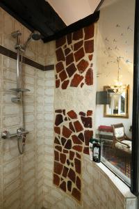 a bathroom with a fake giraffe wall at Baderhaus in Bruck an der Mur