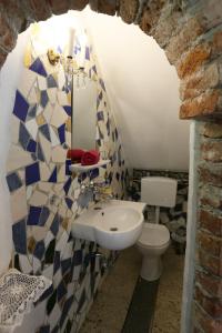 a bathroom with a sink and a toilet at Baderhaus in Bruck an der Mur