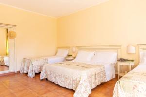 Postel nebo postele na pokoji v ubytování Palazzo Vittoria