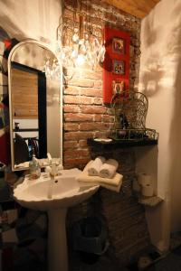 a bathroom with a sink and a mirror at Baderhaus in Bruck an der Mur
