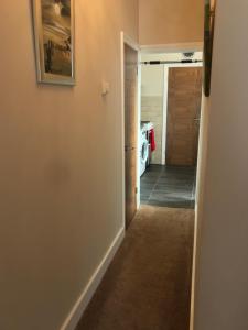 a hallway with a door leading into a room at Richmond Luxury flat Fabulous location in Southend-on-Sea