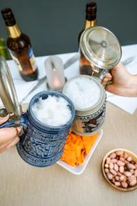 two blue dishes of food on a table with drinks at KIANA KALEİÇİ in Antalya +32 photos