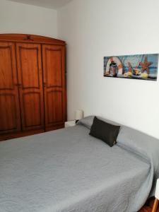 Łóżko lub łóżka w pokoju w obiekcie Apartamentos Flor del Cotillo