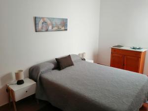 Łóżko lub łóżka w pokoju w obiekcie Apartamentos Flor del Cotillo