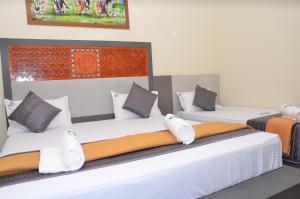 Postel nebo postele na pokoji v ubytování HOTEL PANCHAVARNAA