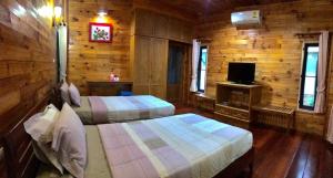 Postel nebo postele na pokoji v ubytování Baan Soontree Resort