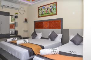 Postel nebo postele na pokoji v ubytování HOTEL PANCHAVARNAA