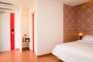 Cama o camas de una habitación en DeMira Hotel