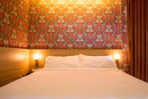 Cama o camas de una habitación en DeMira Hotel