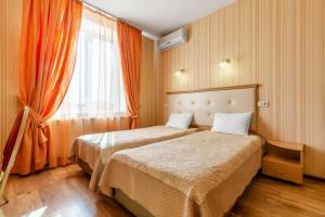 Postel nebo postele na pokoji v ubytování Гостиница Siesta Киев