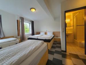Postel nebo postele na pokoji v ubytování Ambiente by Next Inn