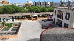 an aerial view of a courtyard with a playground at Apartamentos Neptuno in Platja  d'Aro