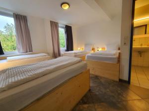 Postel nebo postele na pokoji v ubytování Ambiente by Next Inn