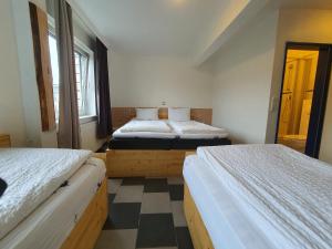 Postel nebo postele na pokoji v ubytování Ambiente by Next Inn