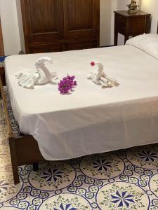 Voodi või voodid majutusasutuse Hotel Al Togo Fitness & Relax toas