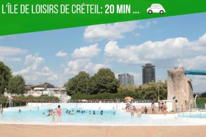 a large swimming pool with people in the water at Saint Georges - ParisSmile in Villeneuve-Saint-Georges