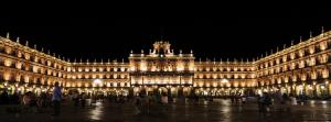 a large building is lit up at night at Hostal Mindanao in Salamanca