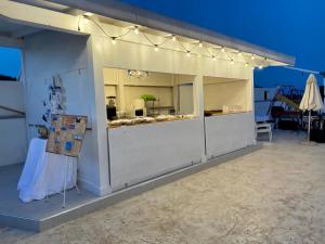 a white building with lights on top of it at Casamediterranea in Sperlonga
