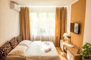 Ένα ή περισσότερα κρεβάτια σε δωμάτιο στο Apartman LUNI