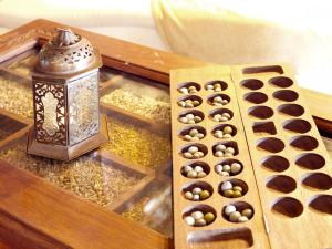 a table with a tray of chocolates and a lantern at The Palms Zanzibar in Bwejuu