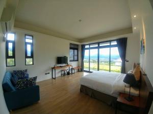 Rúm í herbergi á Yulaikung B&B