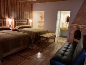 Un pat sau paturi într-o cameră la Cabaña Zacatlan Jacuzzi