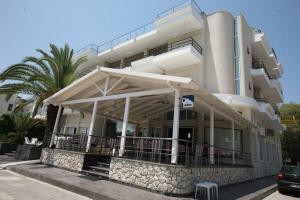 a building with an awning in front of it at Tokalis Boutique Hotel & Spa in Nea Anchialos