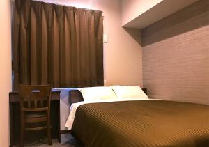 Postel nebo postele na pokoji v ubytování Hotel Trend Omiya