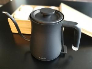 a black tea kettle sitting on a table at Kyoto Central Inn in Kyoto