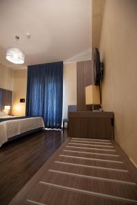 En eller flere senger på et rom på Hotel La Compagnia Del Viaggiatore