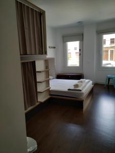 A bed or beds in a room at Agora Hostel
