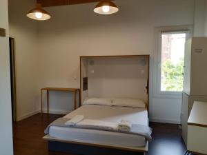 A bed or beds in a room at Agora Hostel