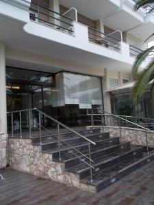 a building with stairs in front of a building at Tokalis Boutique Hotel & Spa in Nea Anchialos
